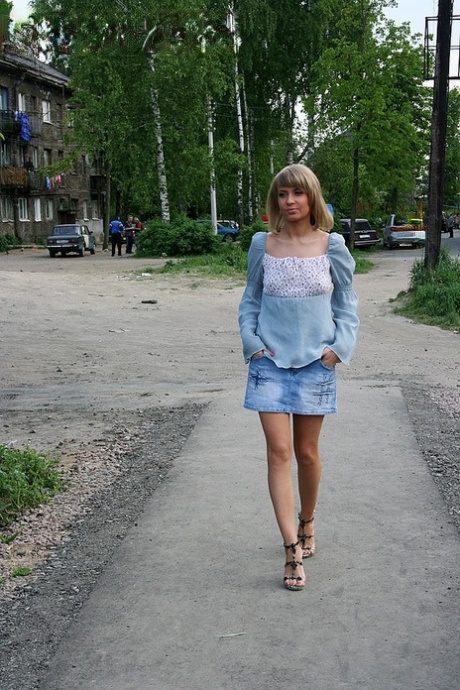 Blonde girl is picked up and banged by two guys in a wooded location