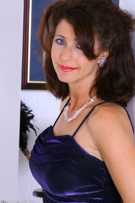 Mature sweetie Madison unveils her fakes and poses in stockings