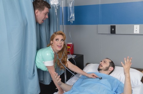 Redheaded pornstar with big tits Penny Pax rides a dick anally in fishnets
